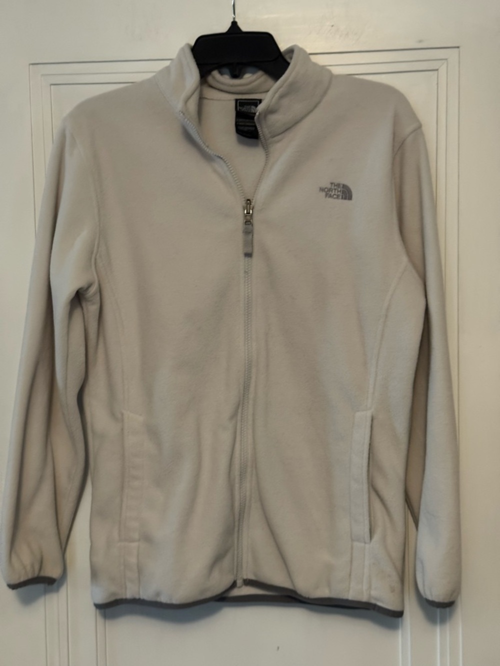 The North Face off white fleece jacket in women’s size medium.